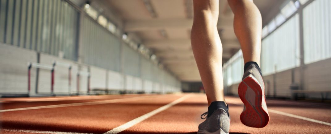 fit athlete during training on running track