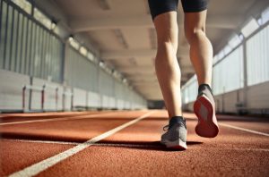 fit athlete during training on running track